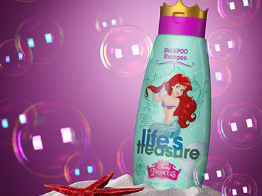 The bottle of shampoo for girls placed in the sand. Red starfish on the left. Soap bubbles around. Dark pink background.