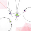 Two Tutù necklaces and  bracelets with ballerinas. In the corners delicate and transparent skeletons pink leaves. White background.